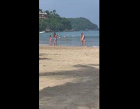 Woman in bikini poses while her daughter takes picture