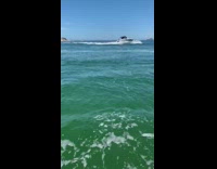 Boat pulls person on red raft fail 