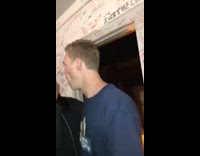 Blonde guy staple guns cheek blue shirt