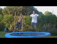 Boy front flips off trampoline fail