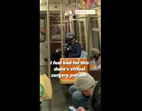 Guy plays with VR headset on subway 