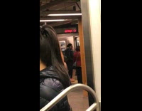 Inflatable orange trex dinosaur halloween costume exits subway train