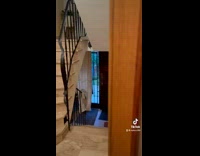 Guy watches tv with friend and toddler 