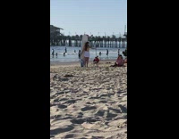 Girl white skirt with surfboard behind beach