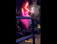 Collab IITW - Woman pink outfit dances selfie with light