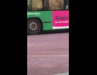 Guy stuffs shirt with socks and makes boobs on chest