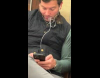 Man chews earphone wires on subway ride