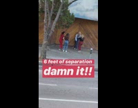 Four girls wood backdrop sidewalk red pants