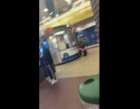 Shirtless guy yellow costume mask window booth 