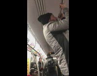 Guy does pull ups on subway train