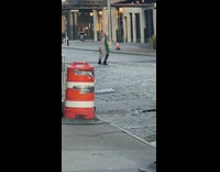 Woman green scarf crazy dance middle street