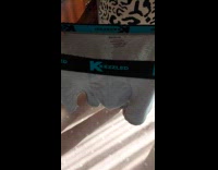 Woman shows underwear with hole after washing