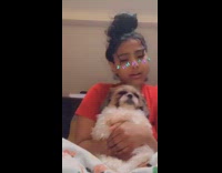 Girl makes dog dance to music butterfly