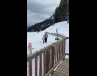 Two kids tiktok dance on snowy mountain
