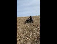 Guy falls over backwards wheelie blue ATV