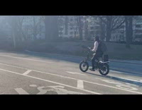 Guy singing karaoke while riding bike