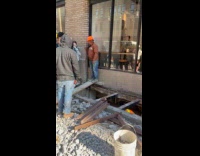 People from shop cross through wood plank