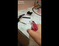 Girl sprays and kills cockroach bug on sink counter with make up 