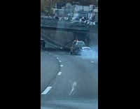 Tow truck drags car against ground fail 