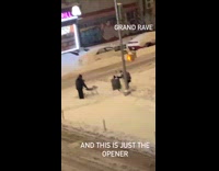 Two guys with table on snow sidewalk 
