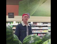 Red hat guy chooses watermelon grocery store 