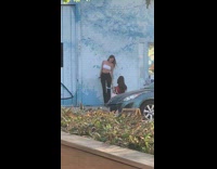 Blonde Lady Poses in Front of Cloud Mural 