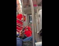 Big and small Elmo rides the subway