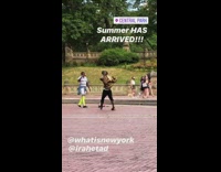 Guy dances takes gold jacket off park