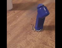 Blue pocket fan spin around on table