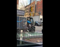 Delivery guy drives electric bike on road