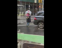 Woman black jacket transparent umbrella selfie street