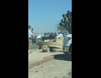 Woman white pants lie down turtle statue