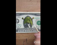 Artist paints shrek on dollar bill 