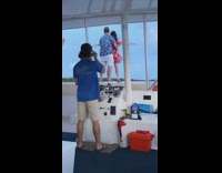 Guy girl titanic pose boat red dress 