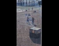 Collab IITW - Woman pink top dances at the beach