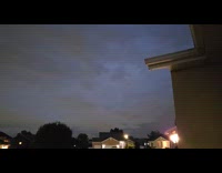 Lightning flickering behind storm clouds 