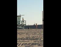 Guy poses on lifeguard tower 