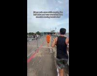 Woman in run overtaken by Fred Flintstone