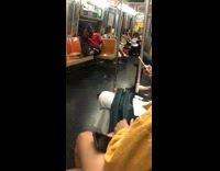 Woman white pants holds lit incense stick smoke on subway train