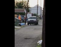 Girl dance water spray pickup truck alley