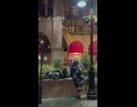 Dog with shades howl man play trumpet