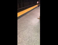 Person gets into Olaf the Snowman mascot suit in subway station