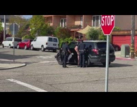 Police arrest a trespassing sunbathing nude person