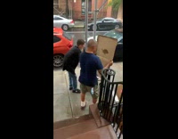 Guy with walker walks quickly in rain 