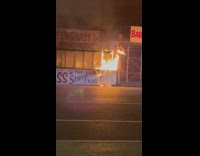White green grass sign on fire on the street