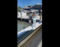 Girl blue pants hold pole boat cocks