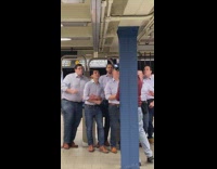Group of white guys dressed the same singing 