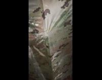 Man Shakes Tent and Walks Around It