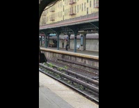 Person dances on subway platform