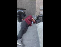 Man nap along the street at day in NY 